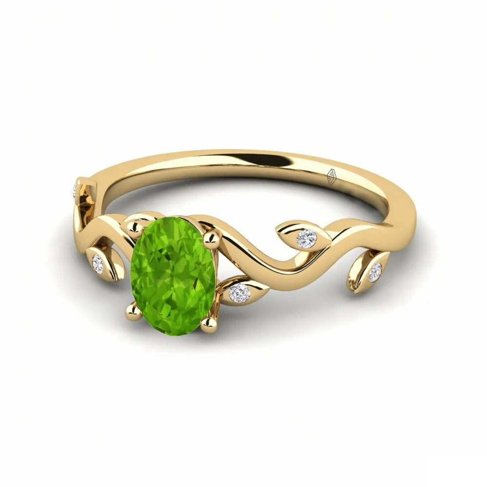 Oval emerald ring with diamond halo