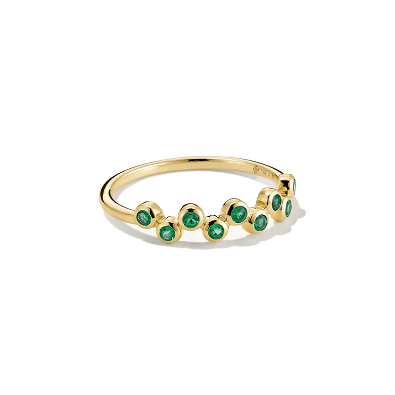 Gold band ring with small emeralds and diamonds